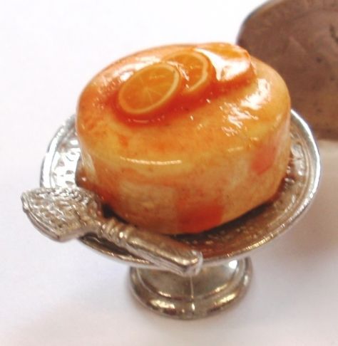 Orange Drizzle Cake on a Silver Stand